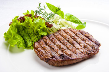 Veal fillet steak on a white plate