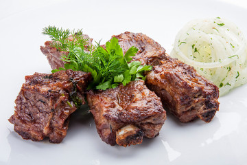 Skewers of pork ribs with onions