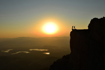 Fototapeta premium joy of the peak of successful, courageous and fearless mountaineers