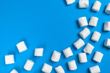 Marshmallows on blue background