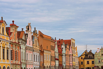 Fototapeta premium Scenic view of row of colorful houses in the main square of the city Telc. It is the main tourist attraction of the city. A UNESCO World Heritage Site. Telc, Southern Moravia, Czech Republic