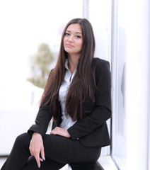 young employee sitting near a window in the office