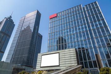 Modern office building against blue sky.