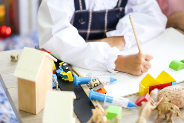 Parent and little child having fun playing educational toys,Family concept.