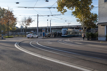 15/08/2018 Zurich, Zwitzerland. VIew of the Train Station and Roads in the Morning. Commuters waiting at  overground train stop.