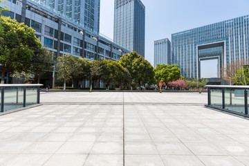 Panoramic skyline and modern business office buildings with empty road,empty concrete square floor © MyCreative