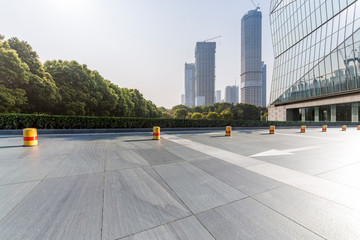 Panoramic skyline and modern business office buildings with empty road,empty concrete square floor