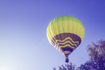 Colorful hot air balloon against the blue sky