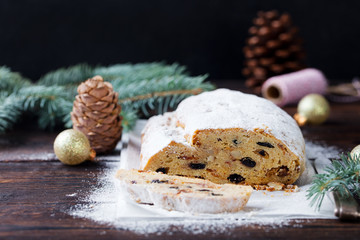 Christmas stollen cake with icing sugar. Traditional Dresdner christ pastry. Copy space.