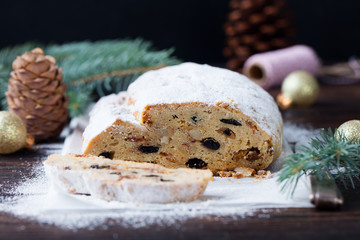 Christmas stollen cake with icing sugar. Traditional Dresdner christ pastry. Close up.