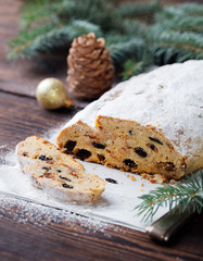 Christmas stollen cake with icing sugar. Traditional Dresdner christ pastry. Copy space.
