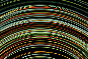 Blurred bright luminous multicolored stripes in the form of an arc from diode bulbs LED from...