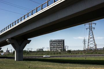 Fototapeta premium Automobile overpass. Cityscape with a road bridge.
