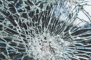 Criminal incident at the bus stop. Shooting a pistol. Hole and cracks in the glass of a city bus...