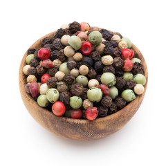 Pepper mix seed on spoon on white background.