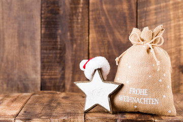 Christmas greeting card wooden background.