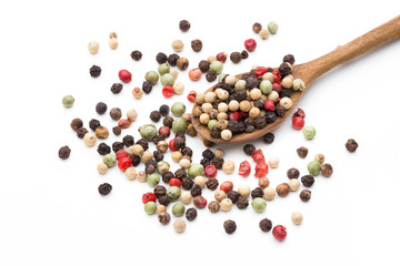 Pepper mix seed on spoon on white background.