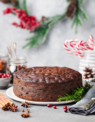 Christmas fruit cake, pudding on white plate. Copy space.