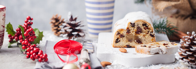 Christmas stollen cake with icing sugar, marzipan and raisins. Traditional Dresdner christ pastry.