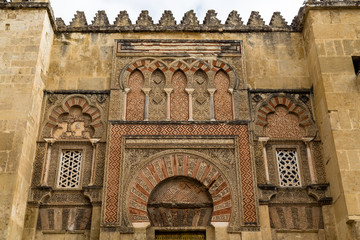 Beautiful decorations on the outside walls of Mezquita, a former Moorish Mosque that is now the Cathedral of Cordoba, Andalucia, Spain. Mezquita is a UNESCO World Heritage Site.