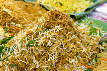 Closeup cooking Pad Thai noodles, Thai street food in the market popular Thai Food Bangkok Thailand  