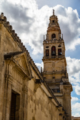 Fototapeta na wymiar Bell tower and former minaret of the Mezquita, Catedral de Cordoba, a former Moorish Mosque that is now the Cathedral of Cordoba. Mezquita is a UNESCO World Heritage Site.