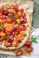 Tomato pizza with ricotta cheese.