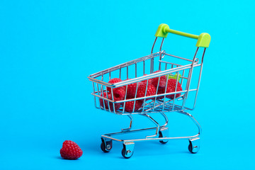 from the supermarket trolley with raspberries, one pumpkin lying near the truck