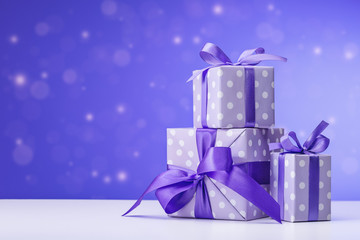  Collection of gifts in different boxes in purple packaging.