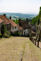 Fototapeta na wymiar Famous Gold Hill Street in Shaftsbury on a sunny day with blue sky, England Dorset