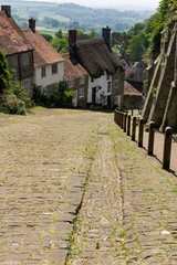 Famous Gold Hill Street in Shaftsbury on a sunny day with blue sky, England Dorset