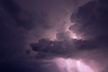 Fototapeta na wymiar Lightning and rain clouds at night