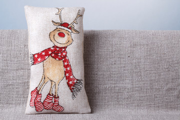 Rudolf Reindeer on a cushion with copy space