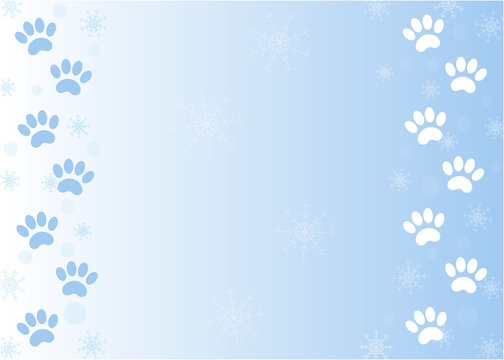 Winter paw prints of Pets on snow blue background frame with copy space for your text.