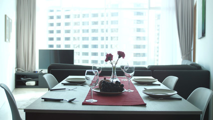 Beautiful serving table banquet in modern apartment by the window