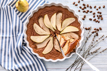 Delicious pear cake on wooden table