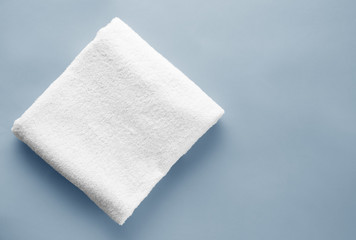 Clean soft towel on color background