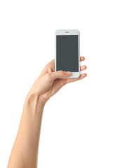 Young woman holding mobile phone on white background