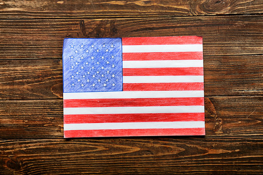Drawing of American national flag on wooden table