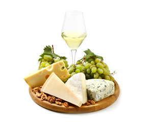 Glass of wine with cheese and ripe grapes on white background