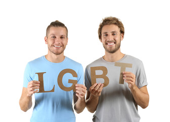 LGBT couple holding letters on white background