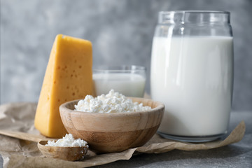 Different milk products on grey  background