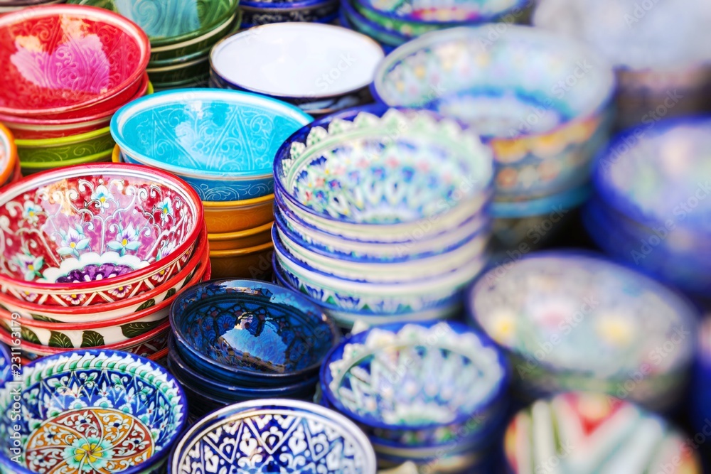 Wall mural Plates and pots on a street market in the city of Khiva Uzbekistan.