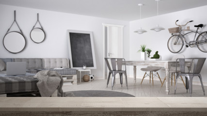 Wooden vintage table top or shelf closeup, zen mood, over blurred modern living room with pallet sofa and vintage dining table, white architecture interior design