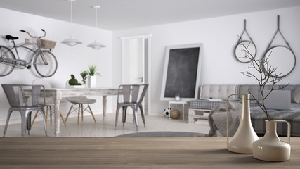 Wooden table top or shelf with minimalistic modern vases over blurred contemporary modern living room with pallet sofa and vintage dining table, architecture interior design