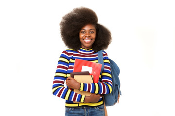 smiling black female college student with books and bag against isolated white background