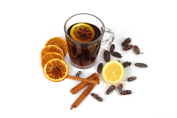 christmas tea or mulled wine - cup of red tea and orange - isolated on white background