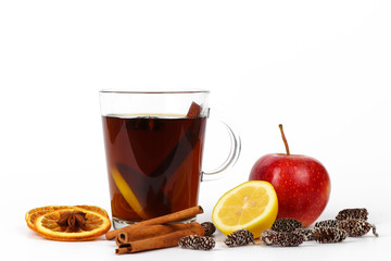 christmas tea or mulled wine - cup of red tea and orange - isolated on white background