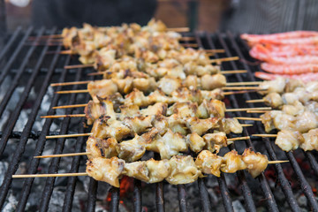 Rapan meat on the grill. Delicious festive barbecue. Food and holiday concept. Cooking BBQ seafood on fire.