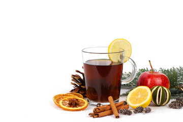 christmas background - christmas tea or mulled wine - cup of red tea and orange - isolated on white background